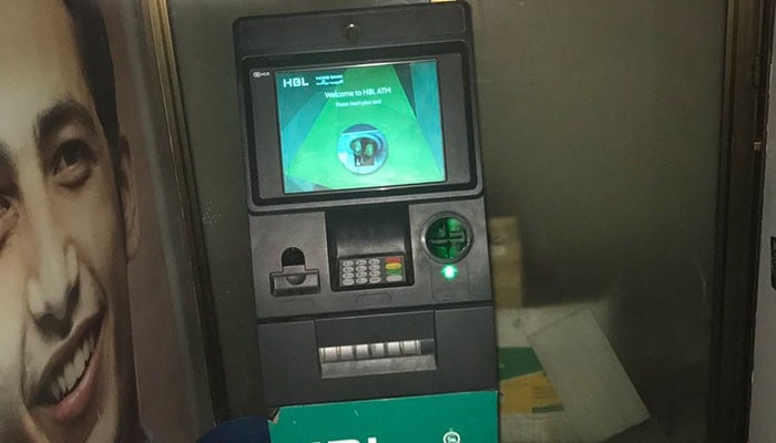 Caught on camera: Fraudsters install skimming device on ATM in Karachi 