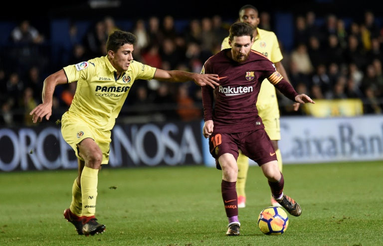 Suarez, Messi maintain Barcelona's La Liga lead