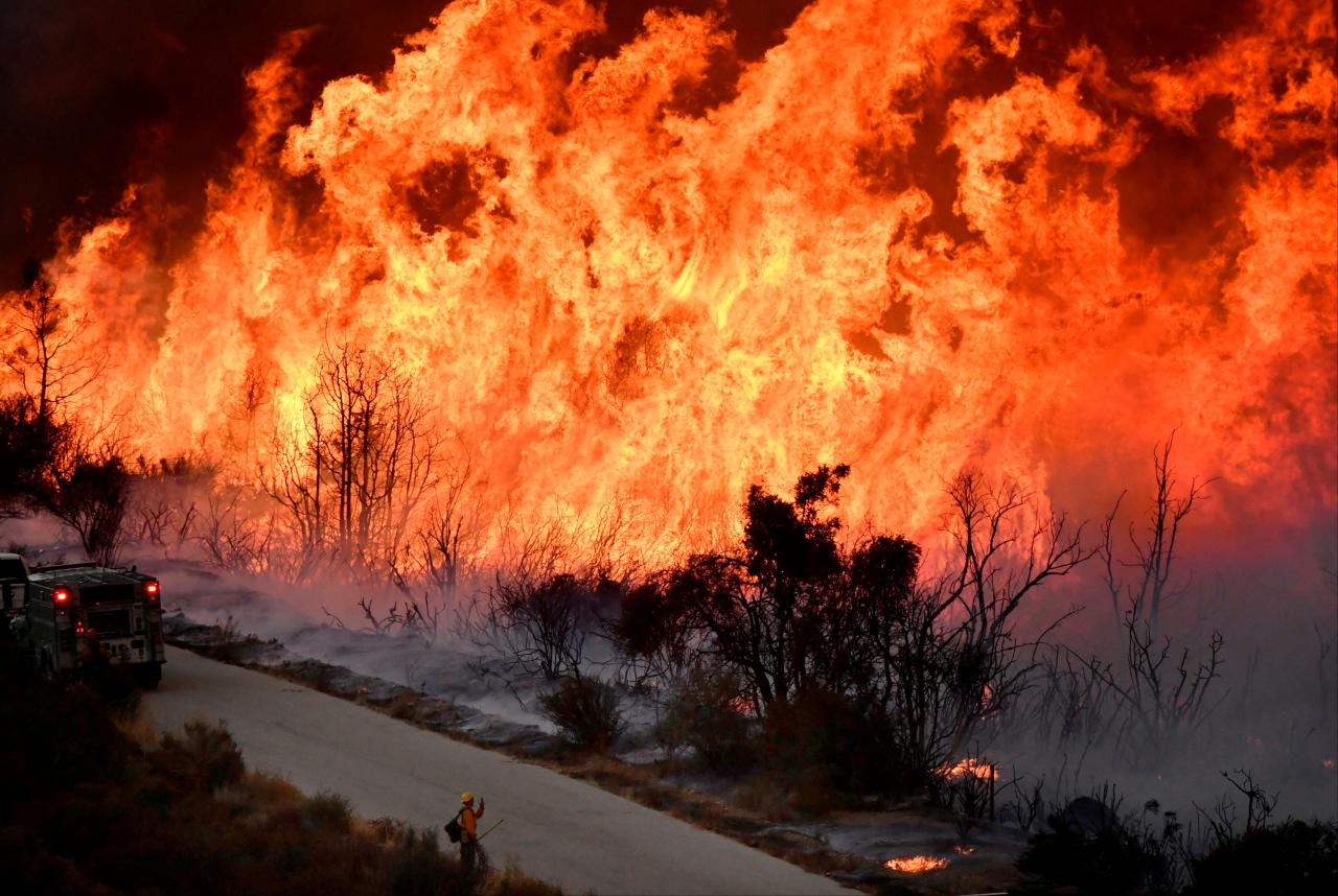 California wildfire rages, threatens communities