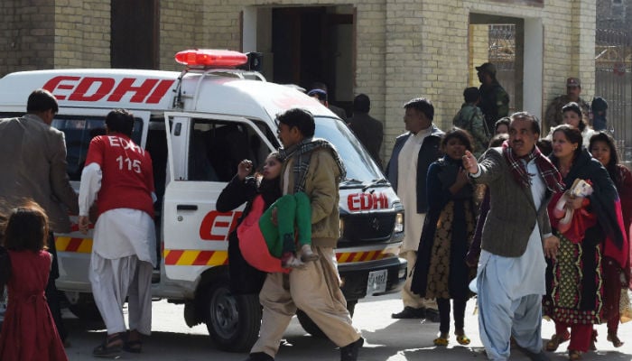Pakistani Christians are evacuated by security personnel from a Methodist church after a suicide bomber attack during a Sunday service in Quetta on December 17, 2017. Photo: REUTERS
