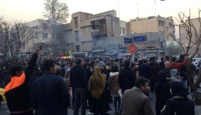 Ten dead in overnight Iran unrest as Rouhani strikes defiant note