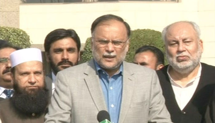 Interior Minister Ahsan Iqbal speaking to media in Lahore