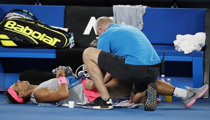 Cilic reaches semi-finals after Nadal retires hurt