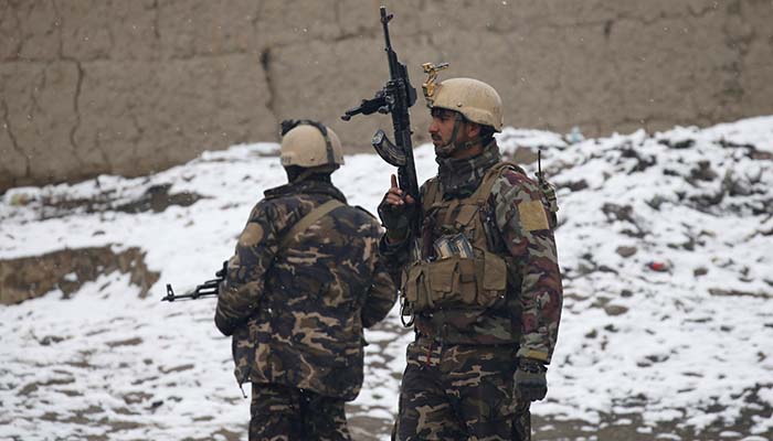 Afghan security forces stand guard near the site of an attack at the Marshal Fahim military academy in Kabul, Afghanistan January 29, 2018 - Reuters