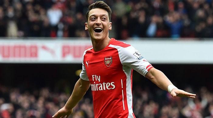 Ozil commits to three-year Arsenal deal