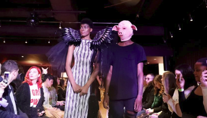 #MeToo fashion show opens with angel wing models, pig-faced men