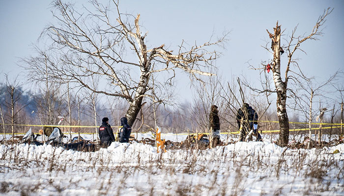 Investigators search snow for clues to deadly Russian plane crash