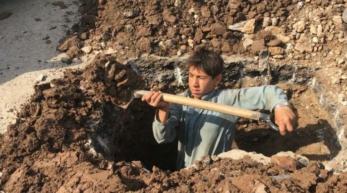 In violation of rules, 14-year-old toils away at Peshawar BRT project 