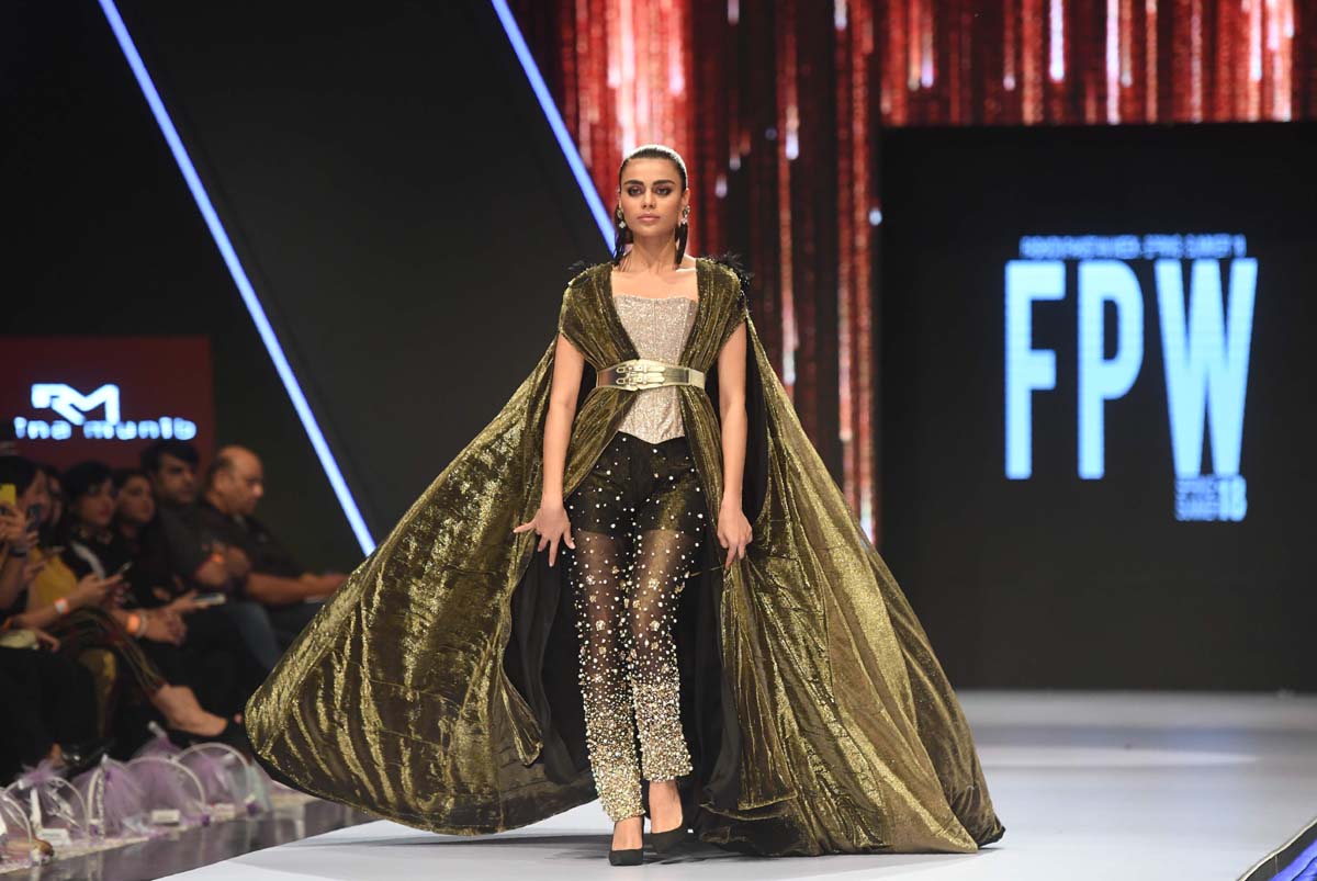A model presents a creation by Rozina Munib. Photo: AFP