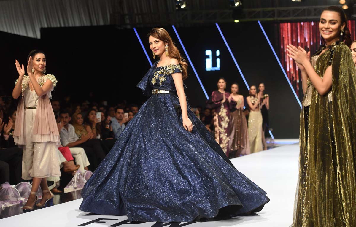 A model presents a creation by Rozina Munib. Photo: AFP