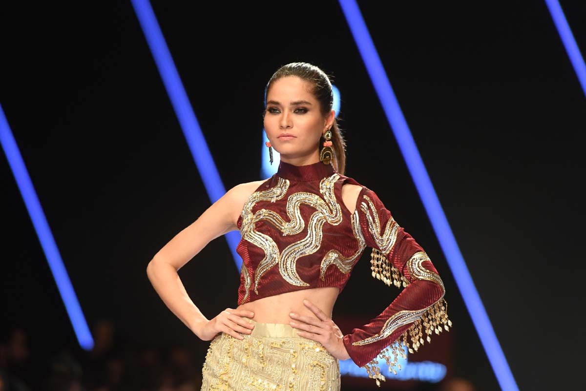 A model presents a creation by Rozina Munib. Photo: AFP