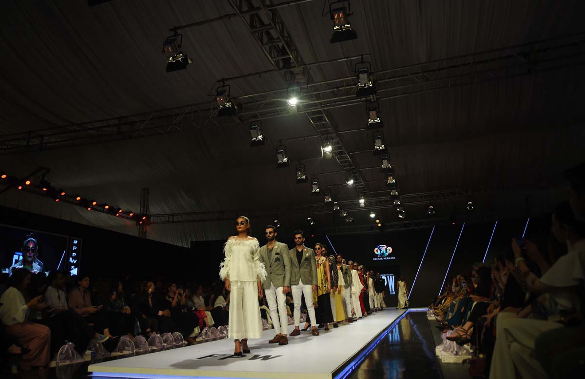 Models present creations by Deepak Perwani. Photo: AFP