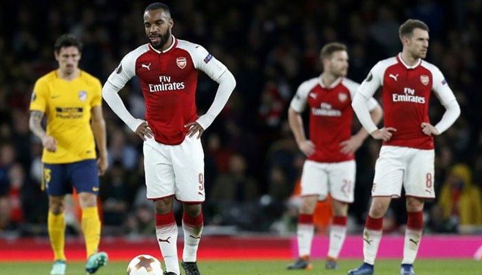 Profligate Arsenal punished by 10-man Atletico Madrid