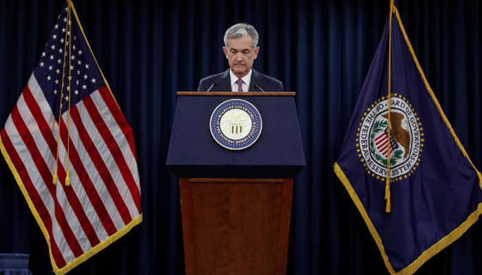 US Fed lifts rates, drops crisis-era guidance