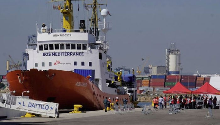Migrants disembark in Spain after Mediterranean standoff