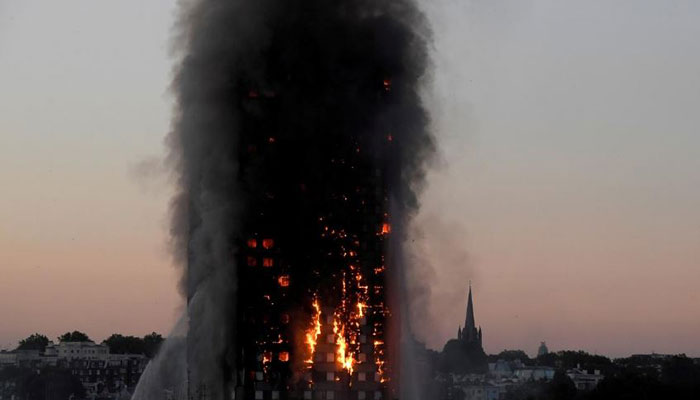 Britain to ban combustible cladding on high-rise buildings after Grenfell fire
