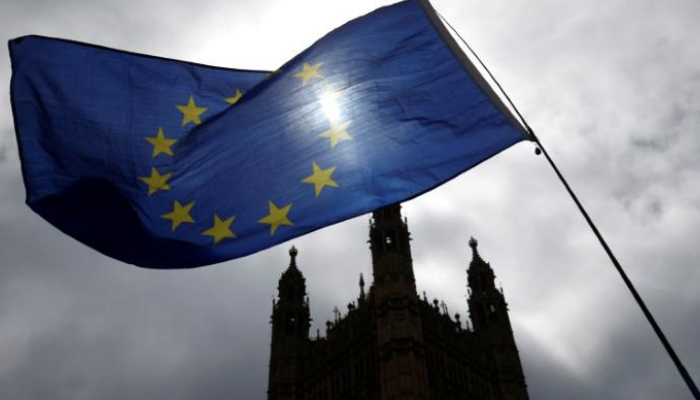 Britain's May survives Brexit vote, EU steps up pressure