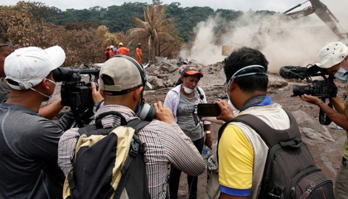 Lone woman digs for family lost under Guatemalan volcanic rubble