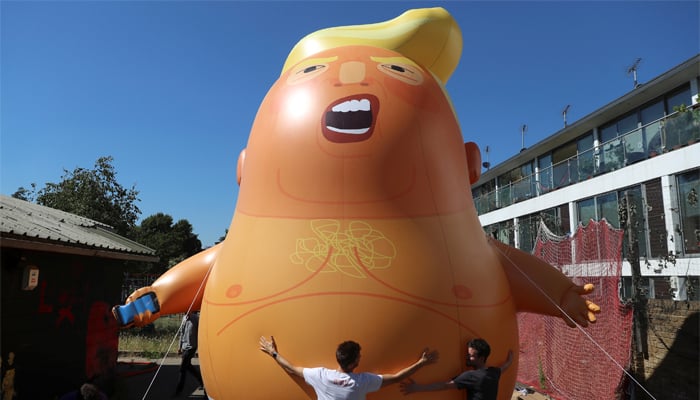 UK protesters inflate snarling orange Trump blimp to mock US president