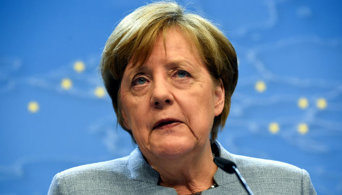 Merkel warns against trade war as Trump takes aim at cars