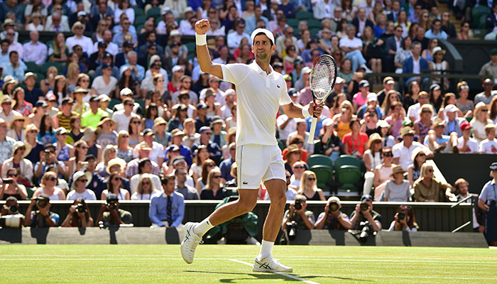 Djokovic into Wimbledon semi-final, blasts 'unnecessary' warnings
