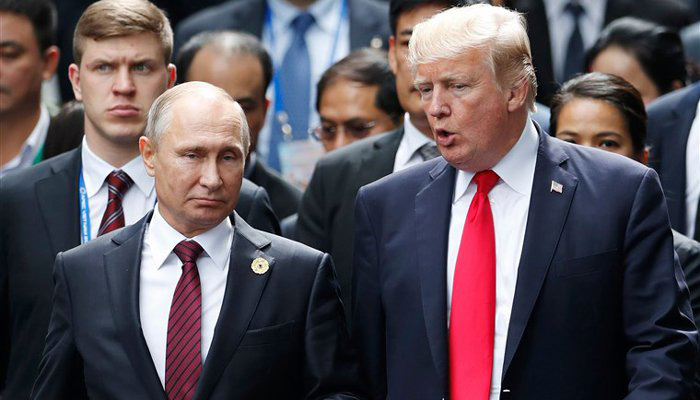 At summit, Trump refuses to confront Putin on vote row