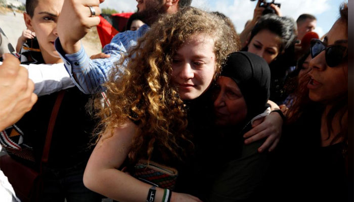 Palestinian teenage protester who slapped Israeli soldier freed from jail