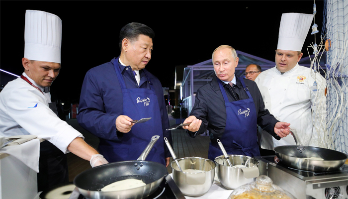 Flipping pancakes! Russia's Putin and China's Xi bond over cooking