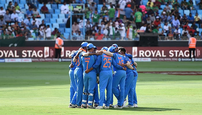 Members of Indian team stand in a huddle before the start of the one day international (ODI) Asia Cup. Photo: AFP.