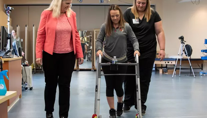 Four paralyzed people walk, stand or sit with new treatment
