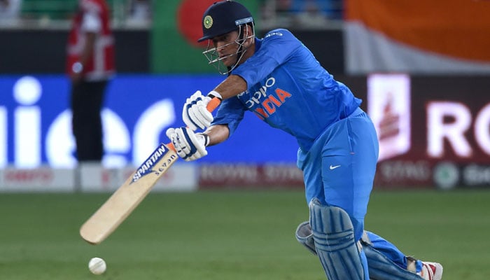 MS Dhoni plays a stroke during the match. Photo: AFP