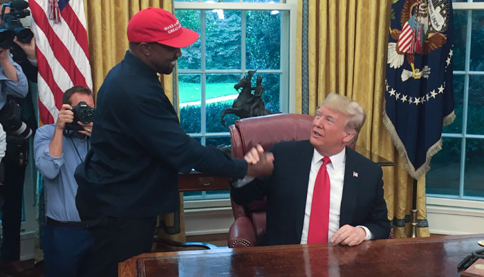 Kanye West loves - and hugs - Trump