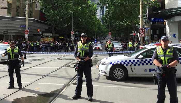 Melbourne attacker swings knife at police, 'trolley man' helps officers