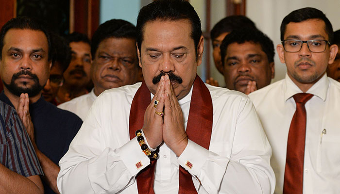 Rajapakse bows out, ending Sri Lanka power struggle