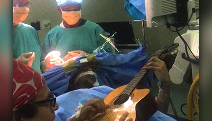 South African jazz artist plays guitar during brain surgery