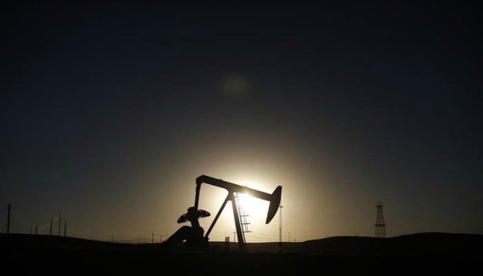 Oil slips back towards 18-month lows on oversupply