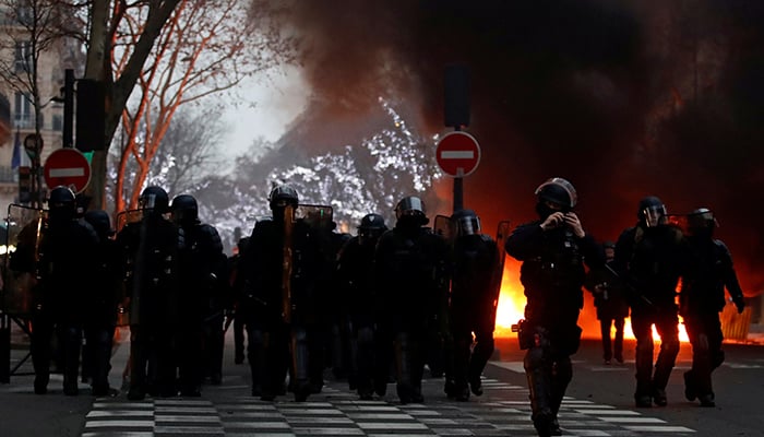 Clashes erupt in Paris as 'yellow vests' protest at unrepentant Macron
