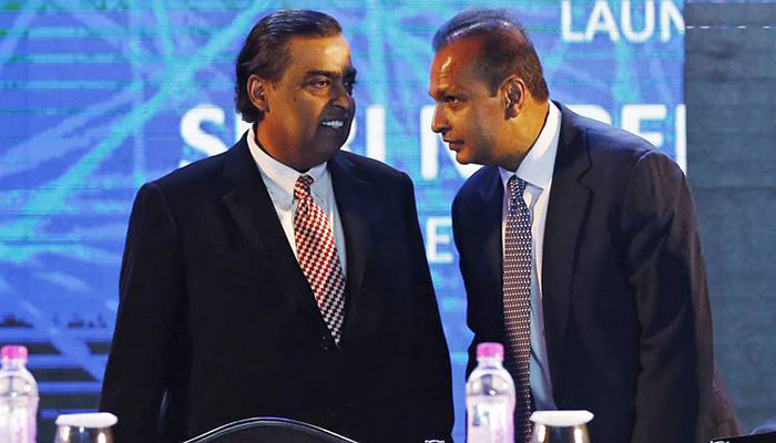 India's richest man helps tycoon brother avoid jail