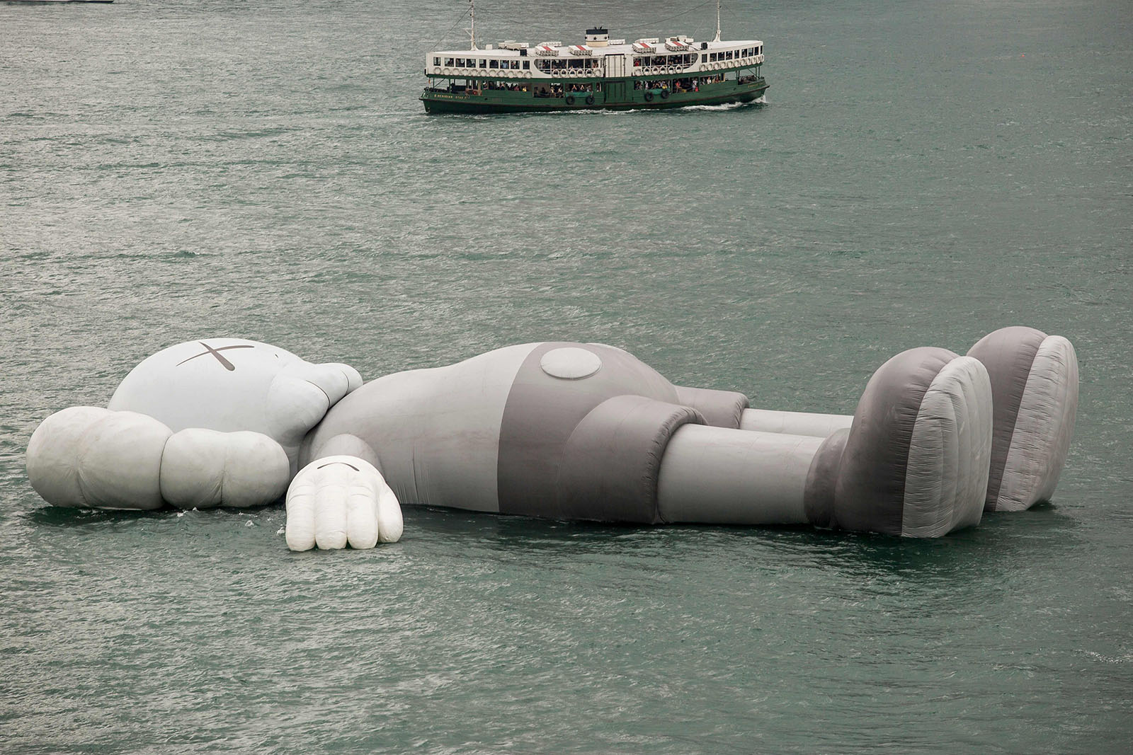 Giant floating KAWS figure arrives in Hong Kong harbour
