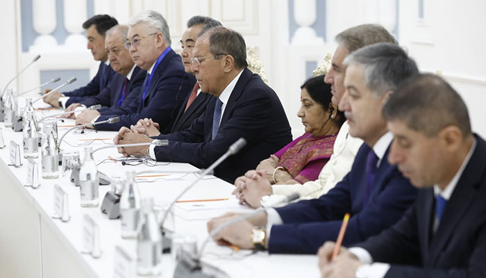 FM Qureshi seated next to Indian counterpart Swaraj during SCO meeting 