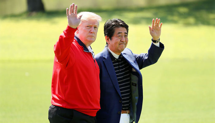 Trade put to one side, Trump and Abe do diplomacy over golf and sumo