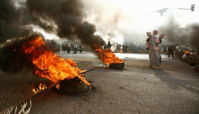 Sudan military, with machine guns, break up protesters' sit-in, leaving 13 dead