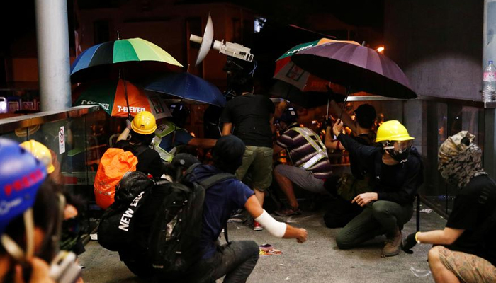 Police fire tear gas, rubber bullets in Hong Kong clash over anti-triad march