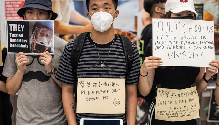 Hong Kong protests bring airport to halt, with China labelling them as 'terrorism'