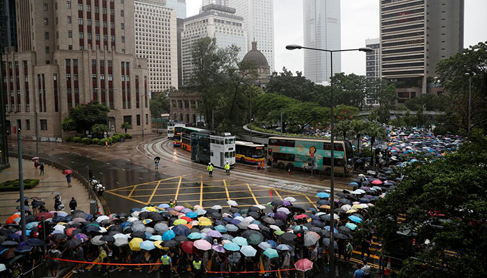 Hong Kongers rally against government under stormy skies