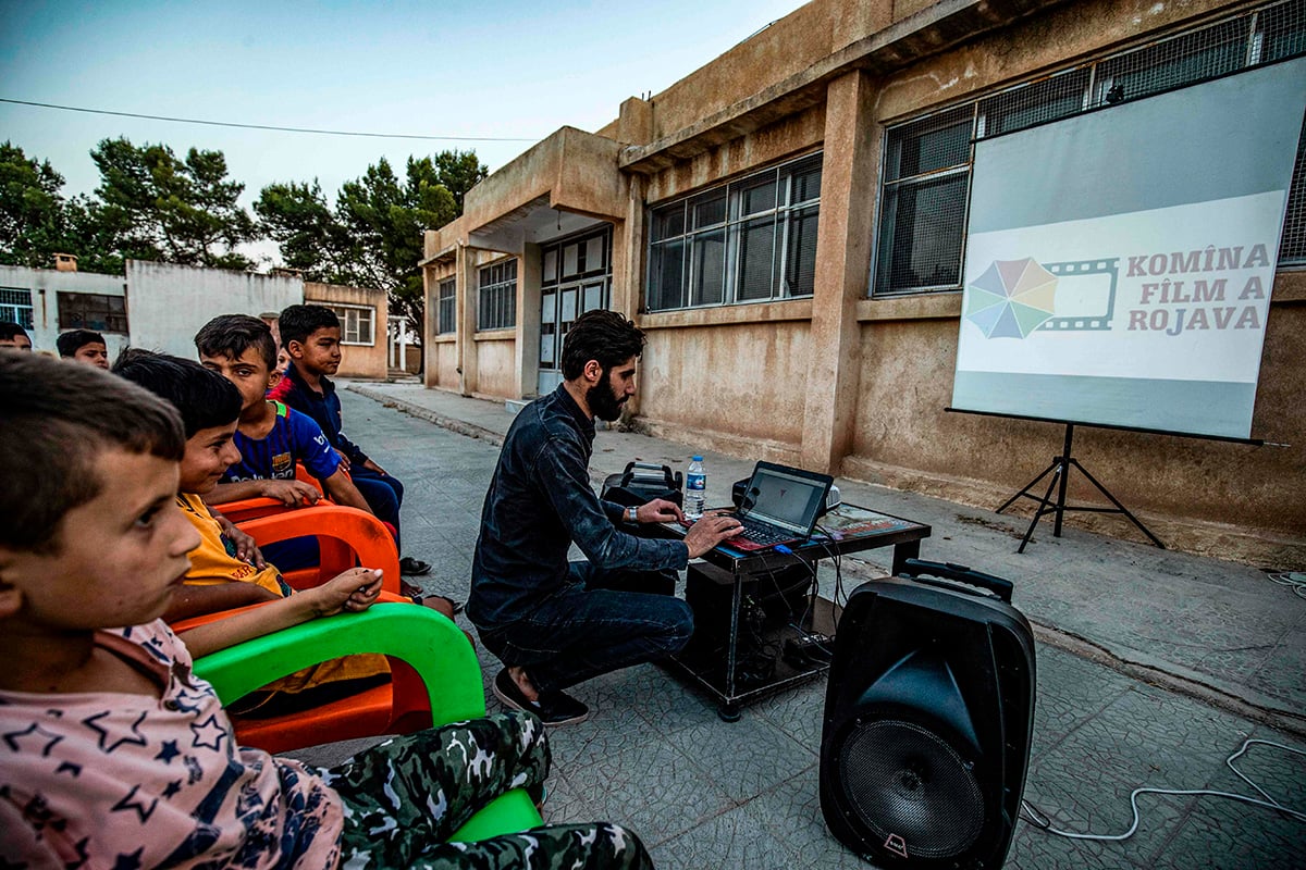 Mobile cinema brings movie magic to Syria's Kurd children