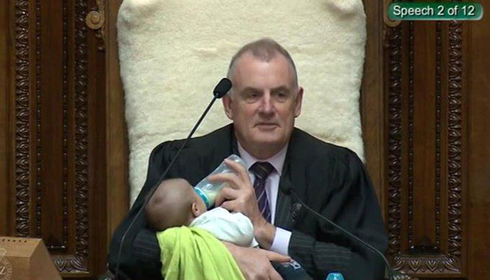 New Zealand speaker cradles newborn baby during Parliament debate