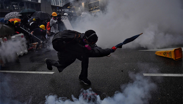 Hong Kong police use water cannon, fire tear gas as protests over surveillance go violent