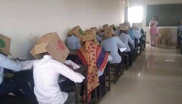 Indian students forced to wear cardboard boxes on their heads to stop cheating during exams