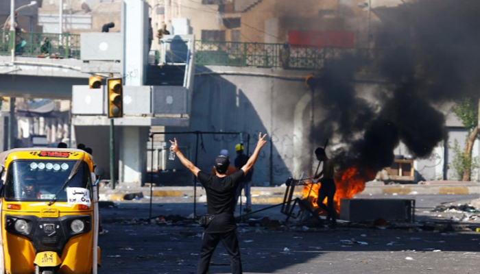 Iraqi forces push protesters back to main square, kill four